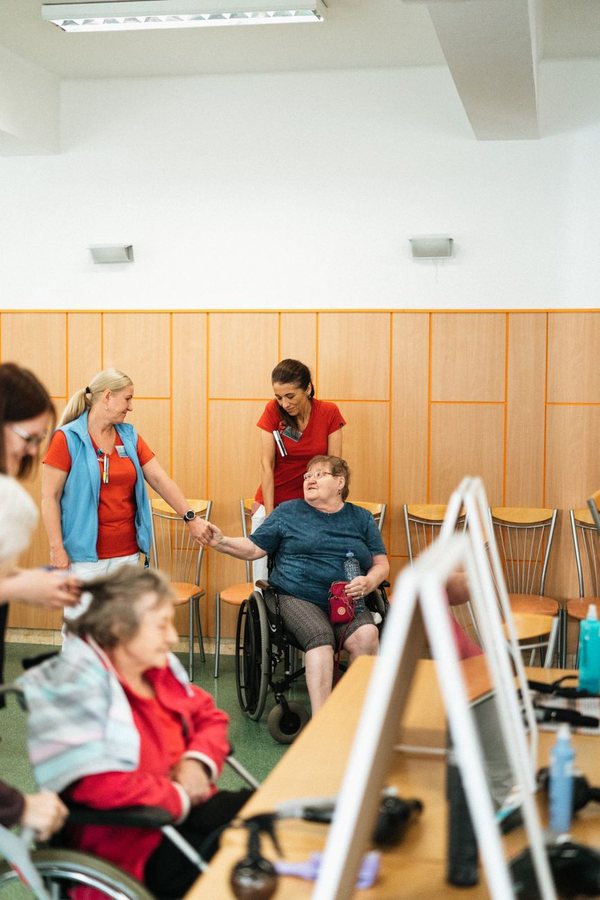 Caregiver assisting with safe stair navigation using proper technique